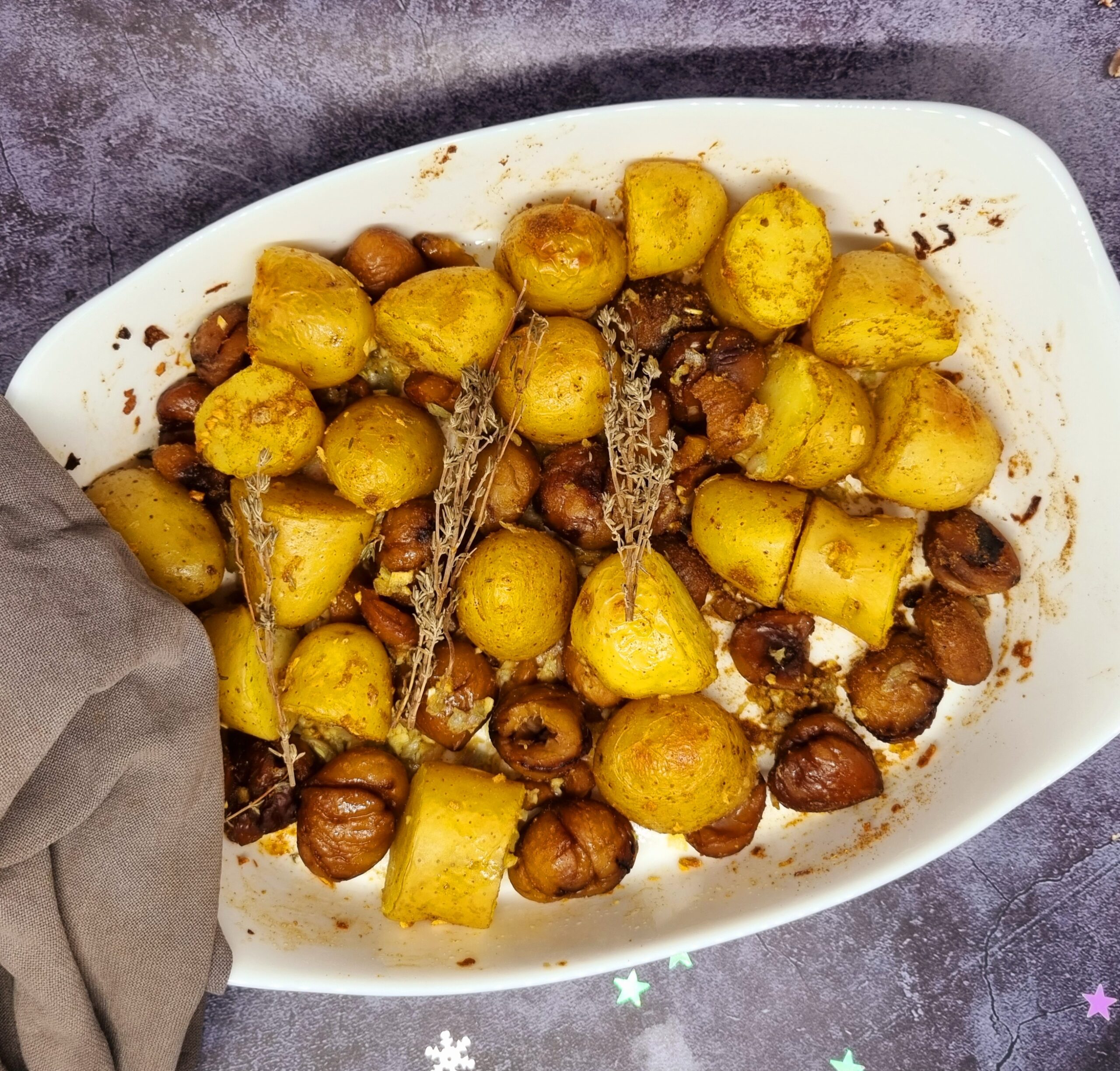 Pommes de terre et châtaignes rôties au cumin